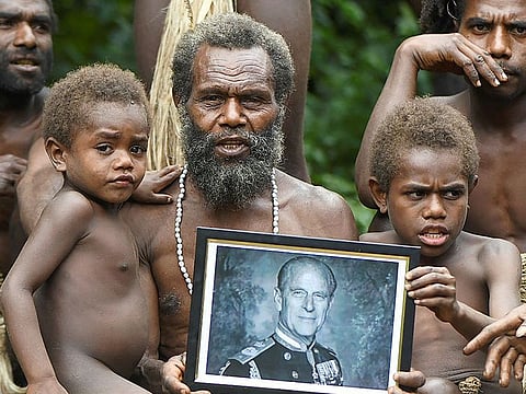 Yakel village chief Albi, and members of his family, holds a portrait of Britain's Prince Philip, Duke of Edinburgh, in the remote Pacific village of Vanuatu.