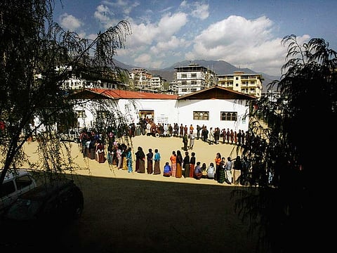 In this March 24, 2008 file photo, Bhutanese people queue up to cast their votes outside a polling station, in Thimphu, Bhutan.Bhutan’s COVID-19 vaccination drive was fast from the start. As other countries rolled out their vaccination campaigns over months, Bhutan is nearly done just 16 days after it started. The tiny Himalayan kingdom has vaccinated nearly 93% of its adults.