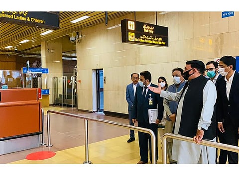 Interior Minister Sheikh Rasheed Ahmed at the terminal building of Karachi International Airport. 