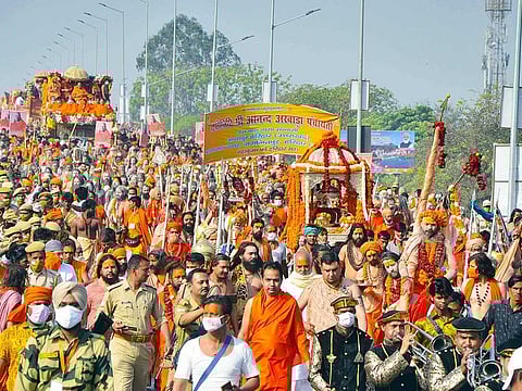 Pilgrims on their way to take a holy dip at Har ki Pauri during Kumbh, in Haridwar on Wednesday, April 14, 2021. 
