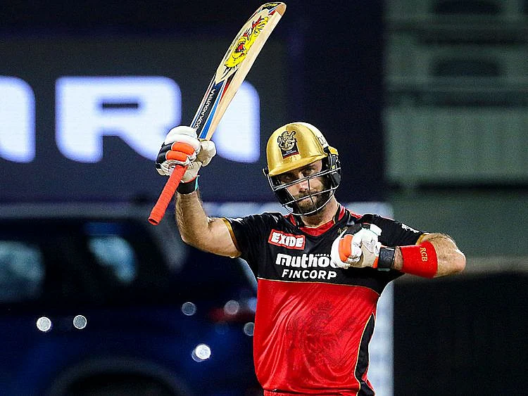 Glenn Maxwell of Royal Challengers Bangalore raises his bat after scoring a fifty against Sunrisers Hyderabad