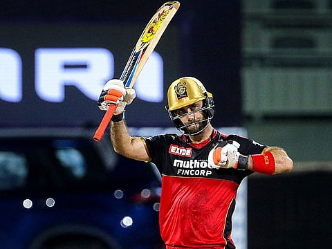 Glenn Maxwell of Royal Challengers Bangalore raises his bat after scoring a fifty against Sunrisers Hyderabad