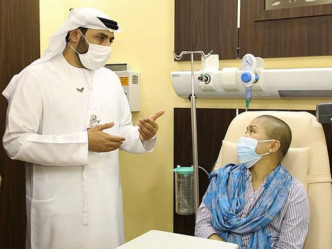 Dr Humaid Al Shamsi, Director of VPS Oncology services, briefs Joylyn Hantig Reano about her course of treatment at Burjeel Hospital for Advanced Surgery in Dubai.