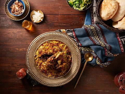 Machboos, is like pilaf or pulao rice cooked with chicken, meat or fish in mild Arabic spice mix 