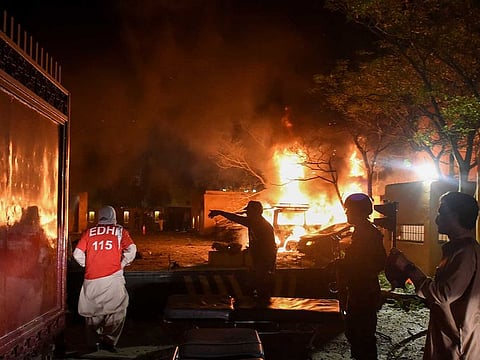 Rescue workers and police officers arrive after an explosion at a luxury hotel in Quetta, Pakistan April 21, 2021. 