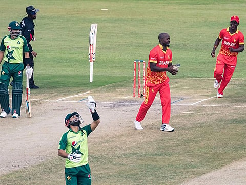 Zimbabwe's Luke Jongwe (2nd R) celebrates after the dismissal of Pakistan's Mohammad Rizwan (C) during the second Twenty20 international at the Harare Sports Club in Harare on April 23, 2021.  