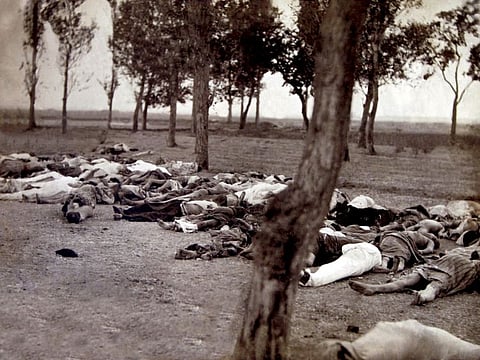 The bodies of deportees from Van who died of typhus and various other diseases, pictured in a forest near the Mother See of Etchmiadzin, about 25km from the Armenian capital of Yerevan, in the summer of 1915.