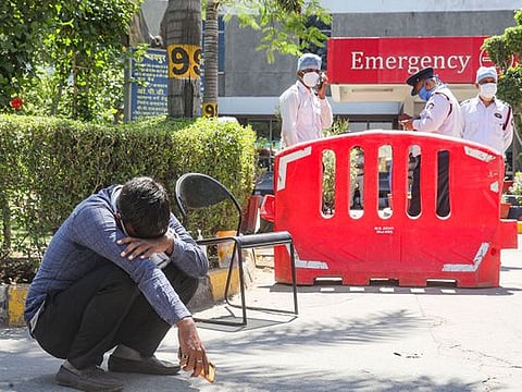 A man breaks down after loosing his relative at Jaipur Golden hospital, Rohini, New Delhi.