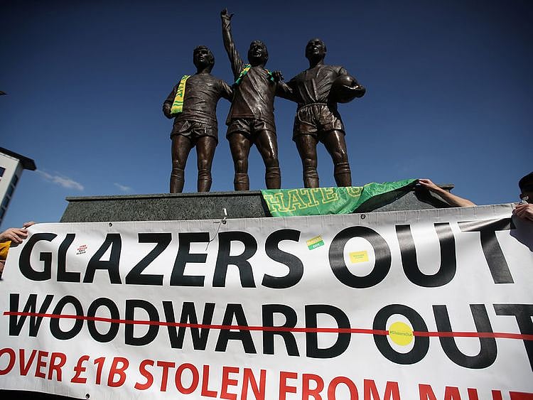 Manchester United fans protest against owners after failed launch of a European Super League at Old Trafford.