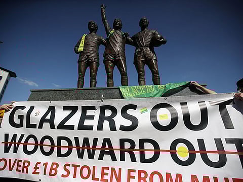 Manchester United fans protest against owners after failed launch of a European Super League at Old Trafford.