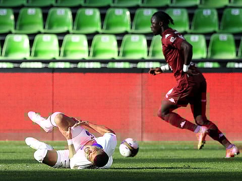 Paris St-Germain's Kylian Mbappe goes down injured against MEtz