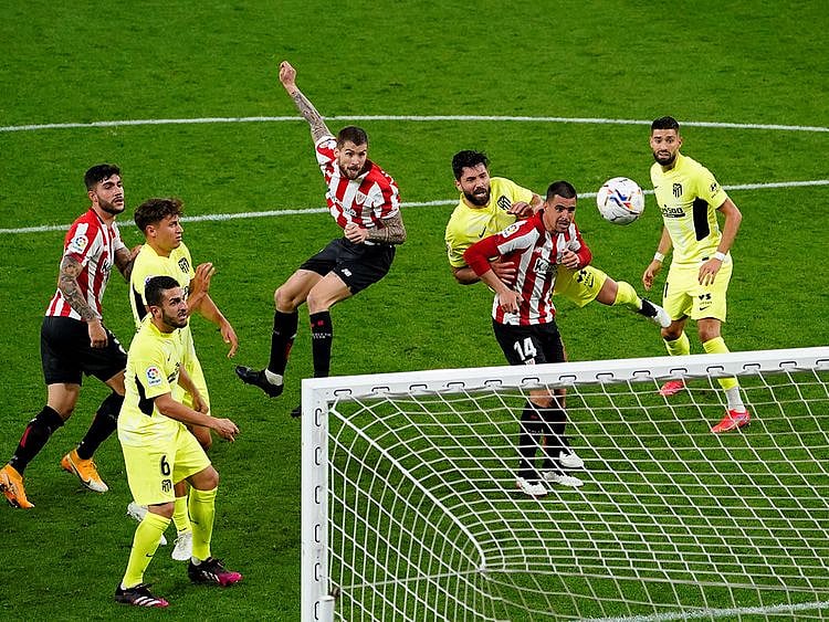 Athletic Bilbao's Inigo Martinez scores their second goal against Atletico Madrid.