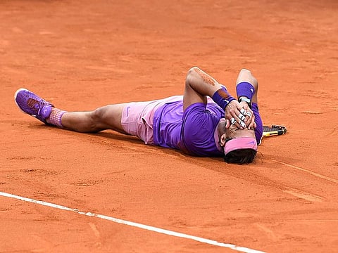Rafael Nadal celebrates his 12th win at the Barcelona Open after outlasting Stefanos Tsitsipas.