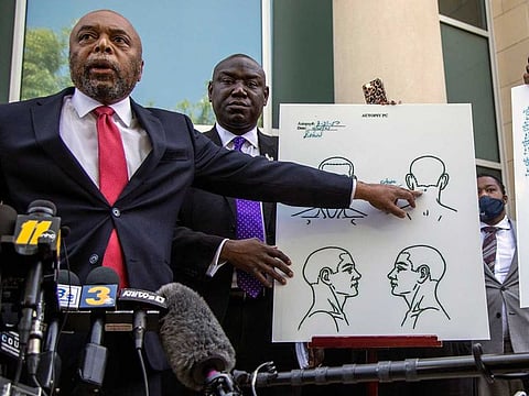 Attorneys for the family of Andrew Brown Jr., Wayne Kendall, left, and Ben Crump hold a news conference Tuesday, April 27, 2021 outside the Pasquotank County Public safety building in Elizabeth City, N.C., to announce results of the autopsy they commissioned.  