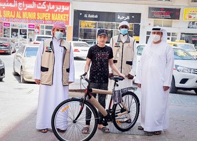 One of the orphans received a bicycle as a gift.