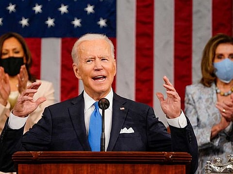  US President Joe Biden addresses a joint session of Congress as US Vice-President Kamala Harris and US Speaker of the House Nancy Pelosi applaud at the US Capitol in Washington, DC, on April 28, 2021. 