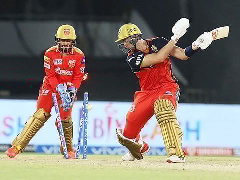 Daniel Sams of Royal Challengers Bangalore is bowled by Ravi Bishnoi of Punjab Kings. 