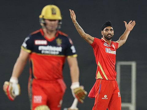 Dream spell: Harpreet Brar of Punjab Kings celebrates the wicket of AB de Villiers of Royal Challengers Bangalore in that match-winning performance. 
