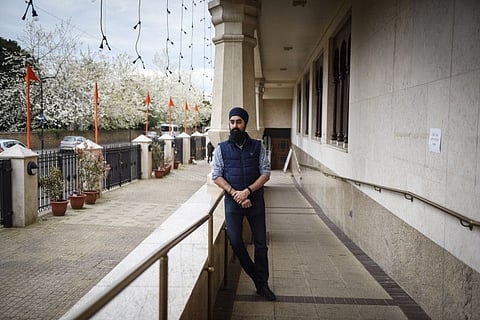Harmeet Gill, who has an uncle in India that just died from COVID-19 and an aunt now hospitalised, at a Sikh temple in the Southall district of London, April 29, 2021. 