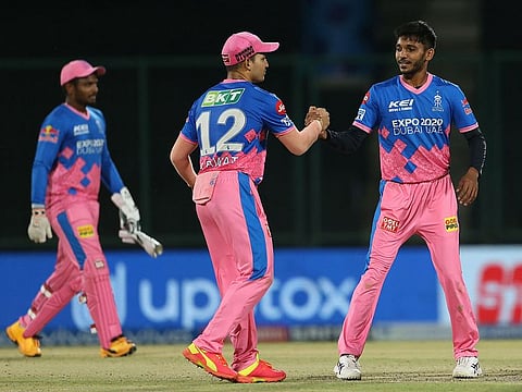 Players shake hands after the match.
