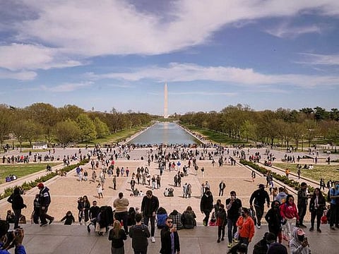 People on the National Mall in Washington, April 3, 2021. Daily vaccination rates are slipping and there is growing consensus among scientists and public health experts that while herd immunity may never be possible, the virus will most likely become a manageable threat that will continue to circulate, causing hospitalisations and deaths but in much smaller numbers.