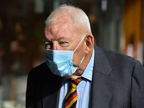 Ron Brierley leaves the Downing Centre District Court in Sydney, Australia, April 1, 2021. The well-known New Zealand businessman who was found with hundreds of child sex abuse images gave up his knighthood Tuesday, May 4, 2021, before it was stripped from him. 