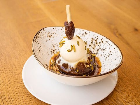 Date pudding with hot caramel sauce and vanilla ice cream