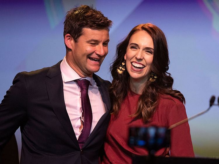 New Zealand Prime Minister Jacinda Ardern, right, is congratulated by her partner Clarke Gayford following her victory speech to Labour Party members at an event in Auckland, New Zealand. 