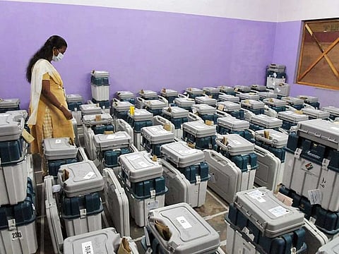 An election official checks the EVM machines for the counting of votes for Kerala Assembly elections, at Mar Ivanios College in Thiruvananthapuram on Sunday, May 2, 2021. 