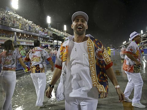 In this Feb. 15, 2015 photo, comedian and actor Paulo Gustavo participates in the Carnival parade at the Sambadrome in Rio de Janeiro, Brazil.