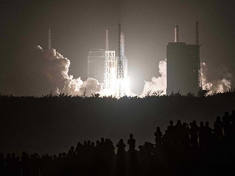 In this file photo a Long March 5B rocket carrying China's Chang'e-5 lunar probe launches from the Wenchang Space Center on China's southern Hainan Island on November 24, 2020, on a mission to bring back lunar rocks, the first attempt by any nation to retrieve samples from the moon in four decades. 