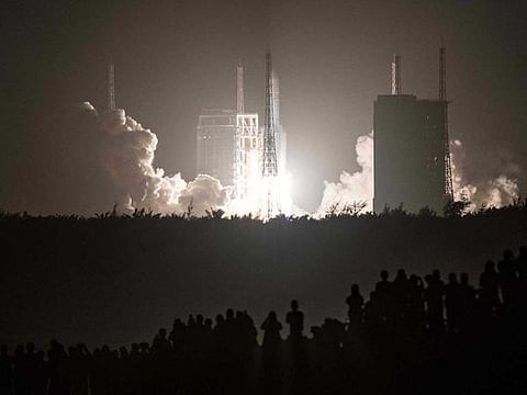 In this file photo a Long March 5B rocket carrying China's Chang'e-5 lunar probe launches from the Wenchang Space Center on China's southern Hainan Island on November 24, 2020, on a mission to bring back lunar rocks, the first attempt by any nation to retrieve samples from the moon in four decades. 