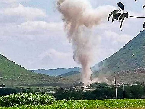 Smoke billows from a blast at a limestone quarry while a consignment of gelatin sticks was being unloaded, at Kalasapadu Mandal in Kadapa district, Saturday, May 8, 2021. 