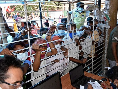 Beneficiaries gather at a COVID-19 vaccine centre during the third phase of the countrywide inoculation drive, in Patna on Monday, May 10, 2021. 
