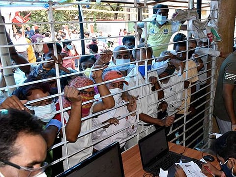 Beneficiaries gather at a COVID-19 vaccine centre during the third phase of the countrywide inoculation drive, in Patna on Monday, May 10, 2021. 