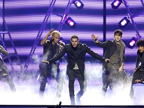 FFile photo shows CNCO performing "Mamita" at the Billboard Latin Music Awards in Las Vegas.