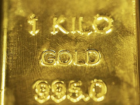 A gold bar on display in a shop window in the Gold Souk in the Deira district of Dubai, United Arab Emirates