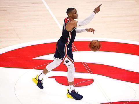 Russell Westbrook #4 of the Washington Wizards points to his team during a game between the Washington Wizards and the Atlanta Hawks at State Farm Arena on May 10, 2021 in Atlanta, Georgia.