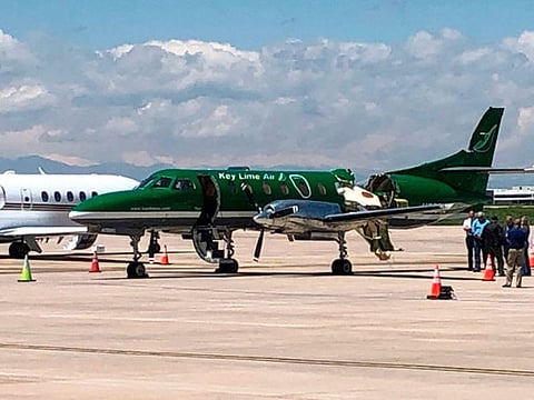 This image from CBS Denver shows a Key Lime Air Metroliner that landed safely at Centennial Airport after a mid-air collision near Denver on Wednesday, May 12, 2021. 