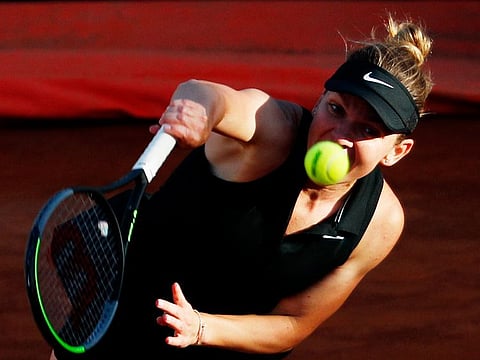 Romania's Simona Simona Halep in action during her second round match against Germany's Angelique Kerber in Italian Open, before a calf injury forced her to pull out on Wednesday.