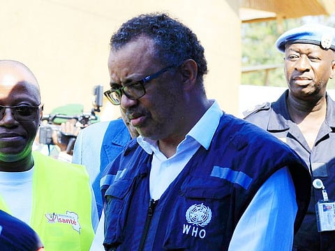 In this file photo dated Friday, August 10, 2018, Dr. Tedros Adhanom Ghebreyesus, WHO Director General, speaks to a health official at a newly established Ebola response center in Beni, Democratic Republic of Congo. 