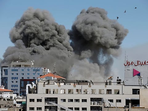 Smoke rises during an Israeli air strike in Gaza City May 15, 2021. 