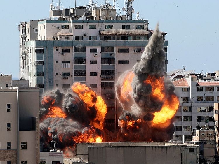 A ball of fire erupts from a building housing various international media, including The Associated Press, after an Israeli airstrike on Saturday, May 15, 2021 in Gaza City.   The attack came roughly an hour after the Israeli military ordered people to evacuate the building, which also housed Al-Jazeera and a number of offices and apartments. There was no immediate explanation for why the building was targeted.