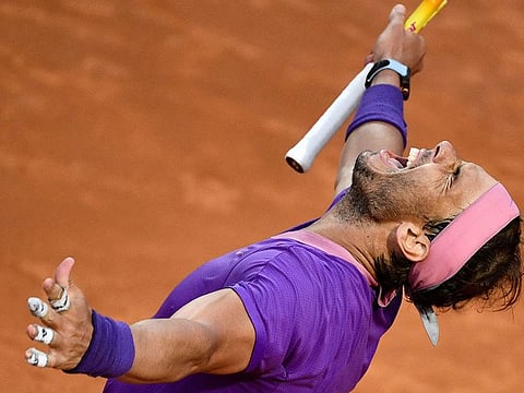 Spain's Rafael Nadal celebrates after defeating Serbia's Novak Djokovic during the final of the Italian Open 