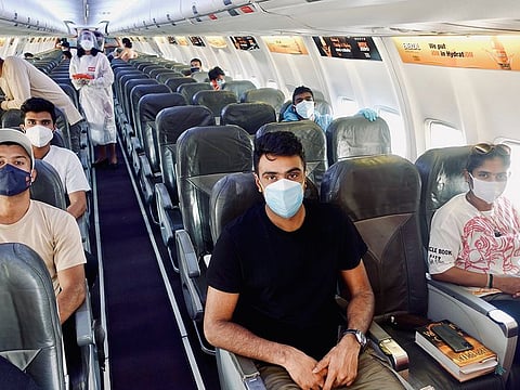 Members of Indian team in a chartered flight head for Mumbai today. Seated are (from left) Mayank Agarwal, Washington Sundar, Ravi Ashwin and women's Test team captain Mithali Raj.