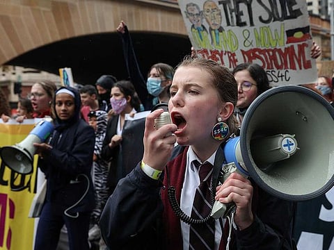 Students march through the city centre during a "School Strike 4 Climate" rally, demanding action on climate change, in Sydney, Australia, May 21, 2021. 