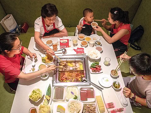 Diners at a Haidilao, China’s most popular hot pot chain, in Beijing. 