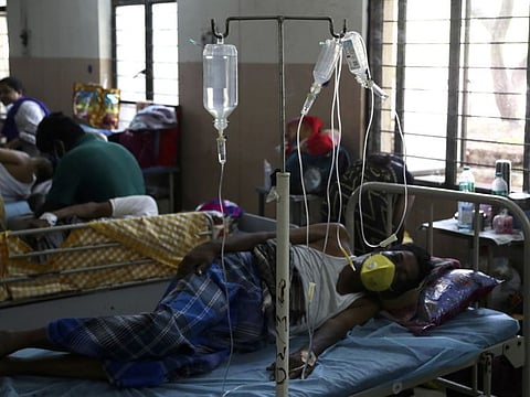 Patients infected with black fungus rest on beds at the Mucormycosis ward of a government hospital in Hyderabad, India.