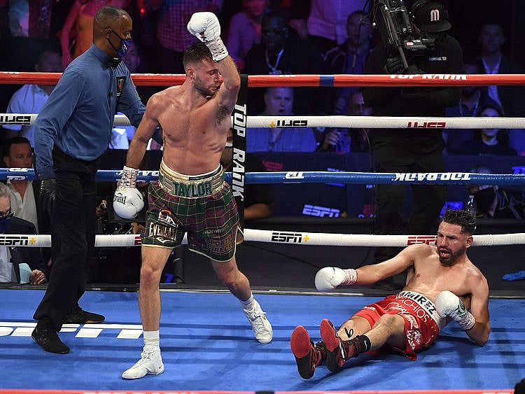 Josh Taylor reacts after knocking down Jose Ramirez during their welterweight world unification title fight at Virgin Hotels Las Vegas 
