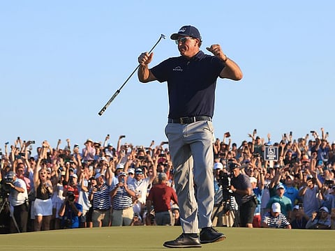 Phil Mickelson of the United States celebrates on the 18th green after winning during the final round of the 2021 PGA Championship held at the Ocean Course of Kiawah Island Golf Resort on May 23, 2021 in Kiawah Island, South Carolina.